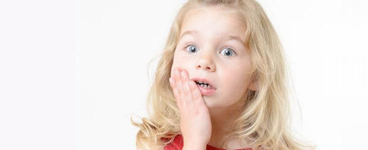 Воспаление десны возле зуба у ребенка